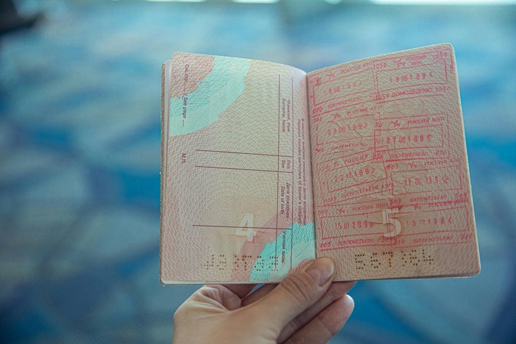 A traveller holding a passport
