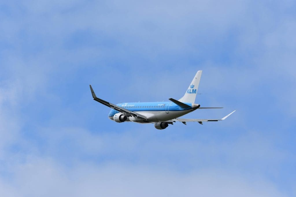 KLM Royal Dutch Airlines aircraft flying in the sky, one of the international carriers with routes to Kilimanjaro International Airport.