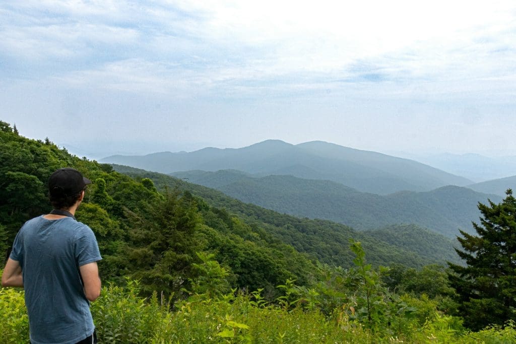 A man standing on Mt Mitchell in the Appalachian mountain range