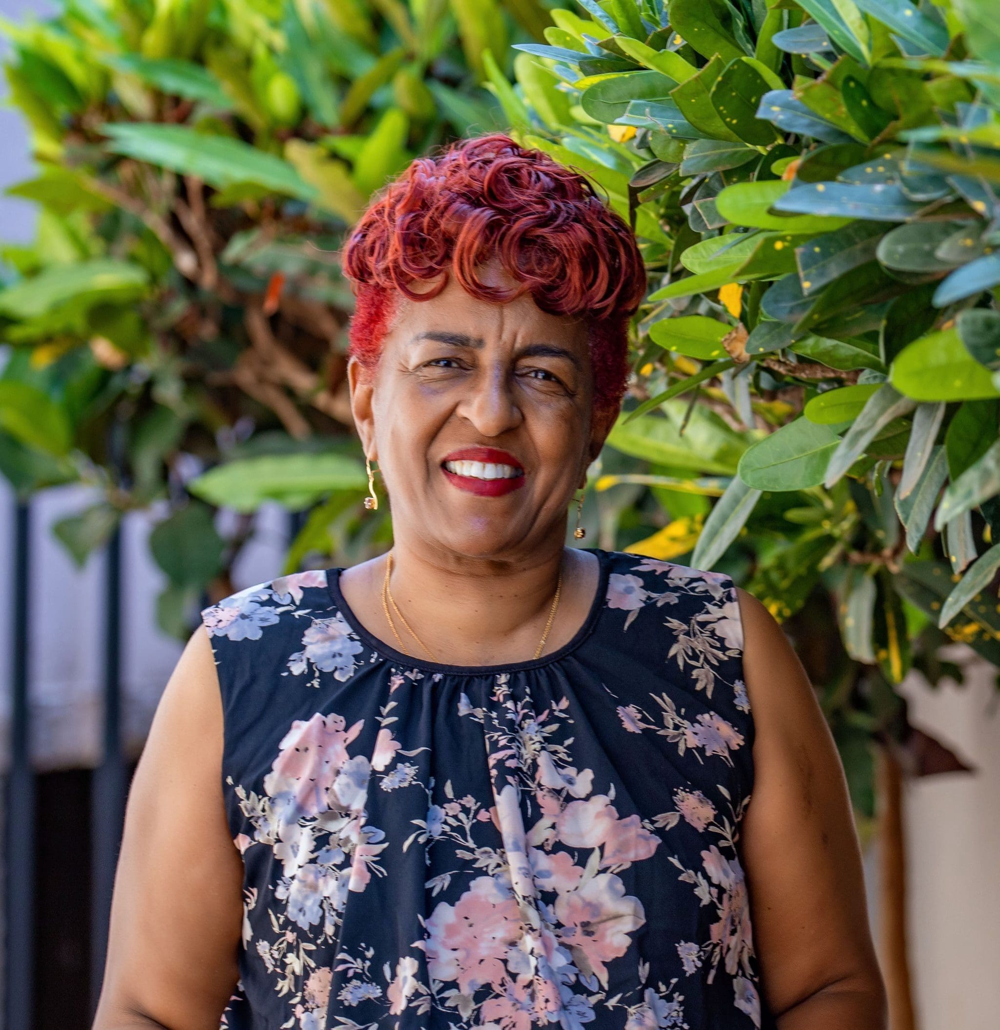 Mama Zara, founder of Zara Tanzania Adventures, stands proudly in Tanzania, smiling