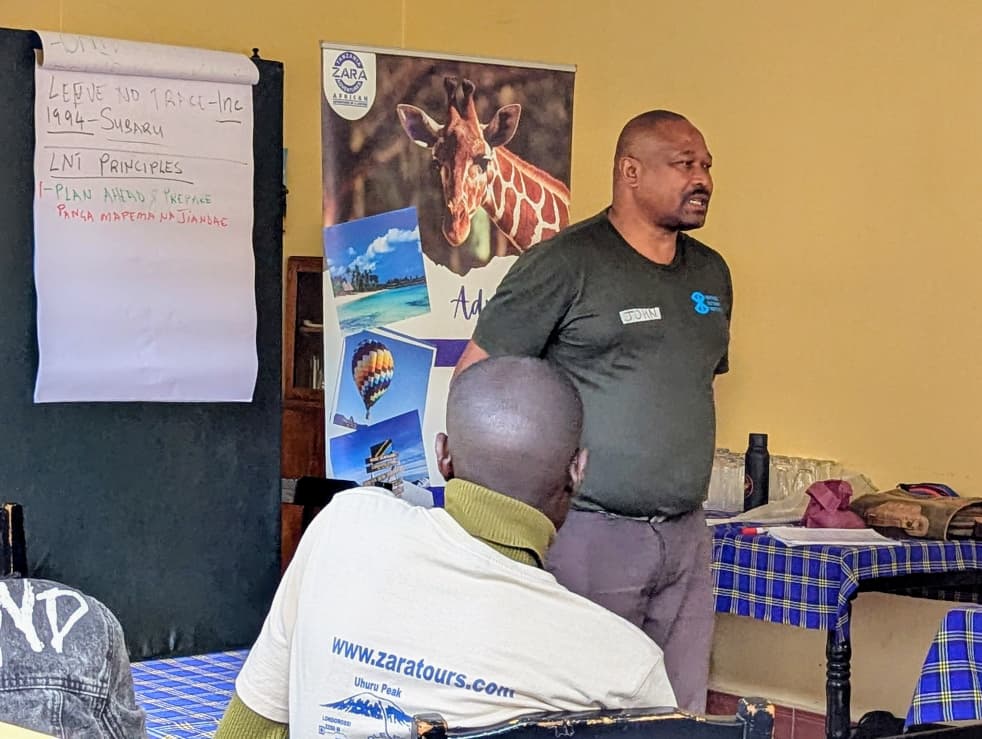 Zara Tanzania Adventures training session on Leave No Trace principles for guides and porters in Moshi, Tanzania.
