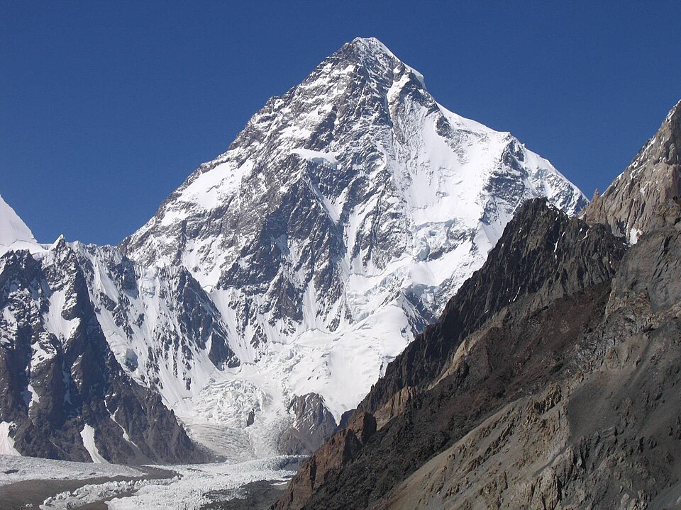 K2 mountain peak, with snow-covered slopes.