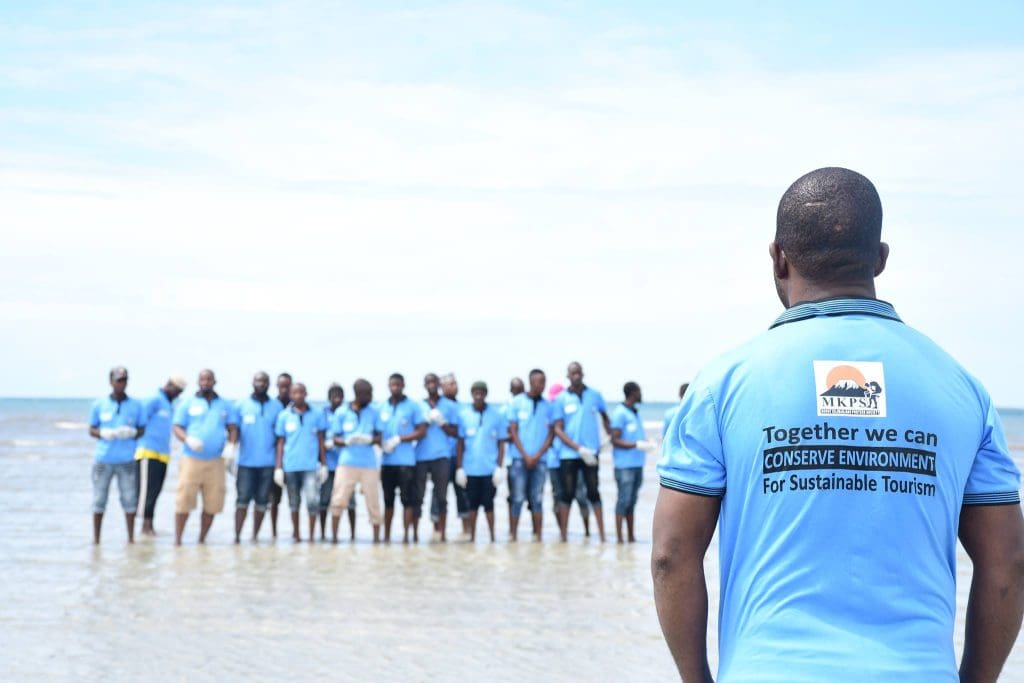 Zara Charity and Mount Kilimanjaro Porters Society volunteers clean up the coastline in Tanzania, promoting ocean conservation and sustainable tourism.