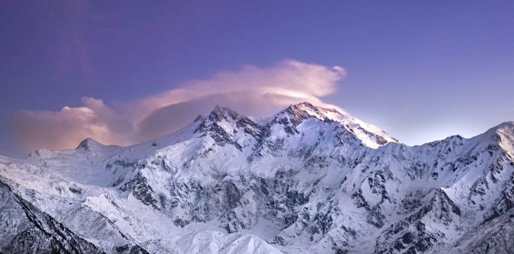 Cloud-covered Nanga Parbat under an overcast sky,